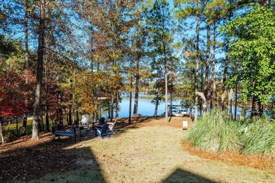 Waterfront home with a boat dock with a jetski dock on a deep on Monticello Golf Club At Savannah Lakes in South Carolina - for sale on GolfHomes.com, golf home, golf lot
