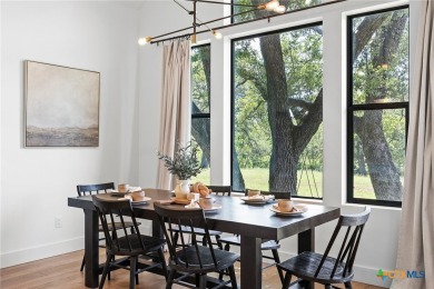 This stunning property offers a perfect blend of tranquility and on Slick Rock Golf Course - Horseshoe Bay in Texas - for sale on GolfHomes.com, golf home, golf lot