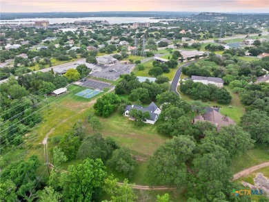 This stunning property offers a perfect blend of tranquility and on Slick Rock Golf Course - Horseshoe Bay in Texas - for sale on GolfHomes.com, golf home, golf lot