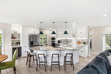 Tranquil golf course views from this 2-bedroom, 2-bath on Quail Ridge Golf Course and Country Club in Florida - for sale on GolfHomes.com, golf home, golf lot