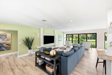 Tranquil golf course views from this 2-bedroom, 2-bath on Quail Ridge Golf Course and Country Club in Florida - for sale on GolfHomes.com, golf home, golf lot