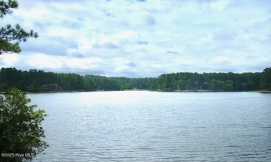 Exceptional .95-acre lakefront lot within the exclusive Pinewild on Pinewild Country Club of Pinehurst in North Carolina - for sale on GolfHomes.com, golf home, golf lot