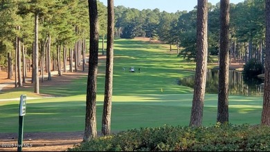 Exceptional .95-acre lakefront lot within the exclusive Pinewild on Pinewild Country Club of Pinehurst in North Carolina - for sale on GolfHomes.com, golf home, golf lot