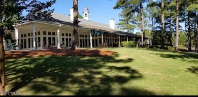 Exceptional .95-acre lakefront lot within the exclusive Pinewild on Pinewild Country Club of Pinehurst in North Carolina - for sale on GolfHomes.com, golf home, golf lot