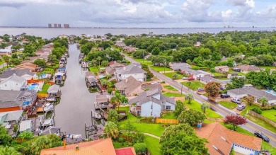 Welcome to this AMAZING Santa Rosa Shores Canal home in Gulf on Tiger Point Golf and Country Club in Florida - for sale on GolfHomes.com, golf home, golf lot