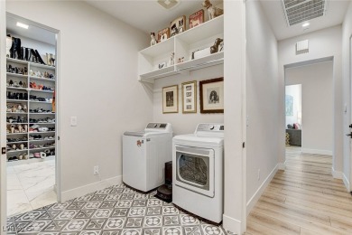 Commanding a premier spot in prestigious MacDonald Highlands on Dragon Ridge Country Club in Nevada - for sale on GolfHomes.com, golf home, golf lot