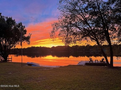 Welcome home to this beautiful lakefront property in Seven Lakes on Seven Lakes Country Club in North Carolina - for sale on GolfHomes.com, golf home, golf lot