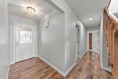 Welcome home to this beautiful lakefront property in Seven Lakes on Seven Lakes Country Club in North Carolina - for sale on GolfHomes.com, golf home, golf lot