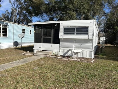 THIS FRESHLY REHABBED HOME OFFERS TINY HOUSE LIVING IN ONE OF on Triple S Golf Ranch in Florida - for sale on GolfHomes.com, golf home, golf lot