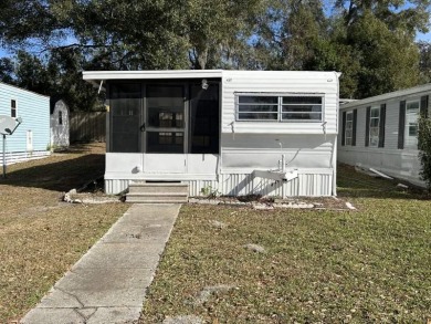 THIS FRESHLY REHABBED HOME OFFERS TINY HOUSE LIVING IN ONE OF on Triple S Golf Ranch in Florida - for sale on GolfHomes.com, golf home, golf lot