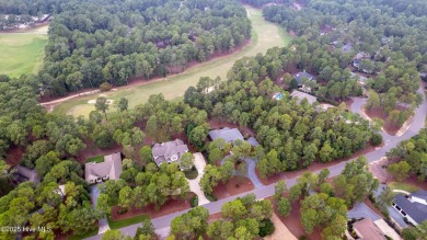 Welcome to this stunning property located in the prestigious on Pinewild Country Club of Pinehurst in North Carolina - for sale on GolfHomes.com, golf home, golf lot