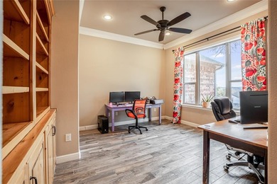 Situated high at the end of a quiet cul-de-sac, this brick and on Pecan Plantation Country Club in Texas - for sale on GolfHomes.com, golf home, golf lot