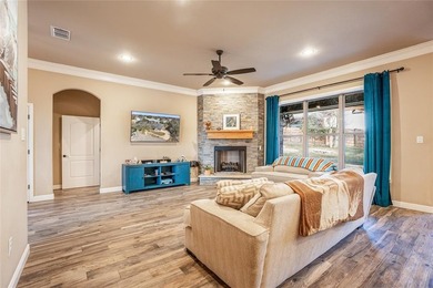 Situated high at the end of a quiet cul-de-sac, this brick and on Pecan Plantation Country Club in Texas - for sale on GolfHomes.com, golf home, golf lot