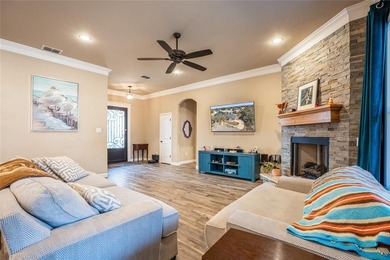 Situated high at the end of a quiet cul-de-sac, this brick and on Pecan Plantation Country Club in Texas - for sale on GolfHomes.com, golf home, golf lot