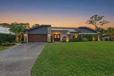 Welcome to this beautifully updated and modern 4-bedroom, 2 on Hamlet Country Club in Florida - for sale on GolfHomes.com, golf home, golf lot