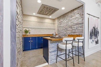 Welcome to this beautifully updated and modern 4-bedroom, 2 on Hamlet Country Club in Florida - for sale on GolfHomes.com, golf home, golf lot