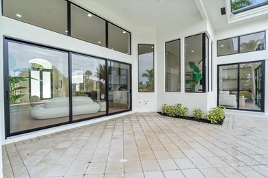 RARELY AVAILABLE COMPLETELY REMODELED CONTEMPORARY SINGLE FAMILY on Breakers Rees Jones Course in Florida - for sale on GolfHomes.com, golf home, golf lot