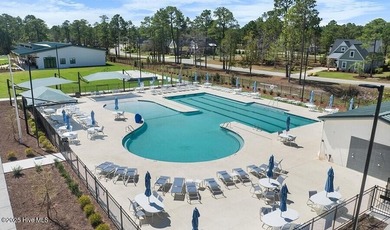 Experience luxury living at its finest in this beautifully on Ocean Ridge Plantation in North Carolina - for sale on GolfHomes.com, golf home, golf lot