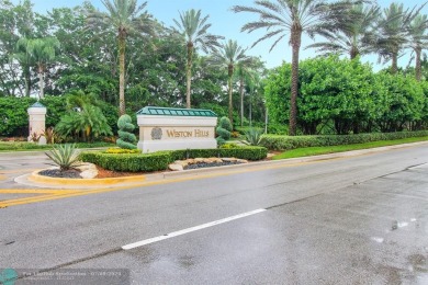 ESPECTACULAR MODERN HOME WITH SMART HOME SONOS SYSTEM, SITUATED on Weston Hills Country Club in Florida - for sale on GolfHomes.com, golf home, golf lot