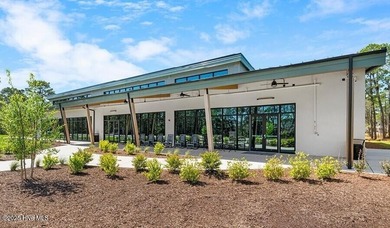 Experience luxury living at its finest in this beautifully on Ocean Ridge Plantation in North Carolina - for sale on GolfHomes.com, golf home, golf lot