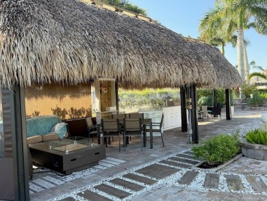 Welcome to this enchanting waterfront & golf-front tiki Lot! on Motorcoach Resort Golf Course in Florida - for sale on GolfHomes.com, golf home, golf lot