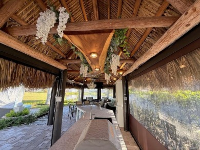 Welcome to this enchanting waterfront & golf-front tiki Lot! on Motorcoach Resort Golf Course in Florida - for sale on GolfHomes.com, golf home, golf lot