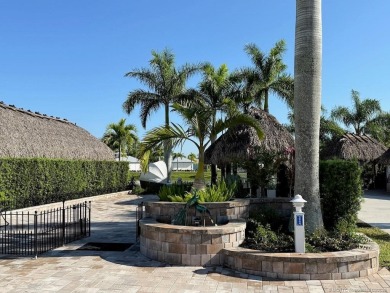 Welcome to this enchanting waterfront & golf-front tiki Lot! on Motorcoach Resort Golf Course in Florida - for sale on GolfHomes.com, golf home, golf lot