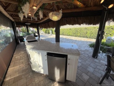 Welcome to this enchanting waterfront & golf-front tiki Lot! on Motorcoach Resort Golf Course in Florida - for sale on GolfHomes.com, golf home, golf lot