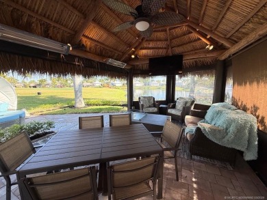 Welcome to this enchanting waterfront & golf-front tiki Lot! on Motorcoach Resort Golf Course in Florida - for sale on GolfHomes.com, golf home, golf lot