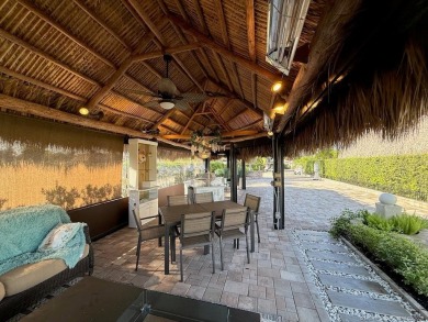 Welcome to this enchanting waterfront & golf-front tiki Lot! on Motorcoach Resort Golf Course in Florida - for sale on GolfHomes.com, golf home, golf lot