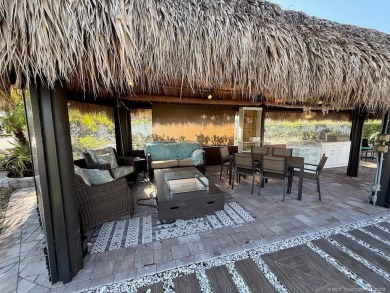 Welcome to this enchanting waterfront & golf-front tiki Lot! on Motorcoach Resort Golf Course in Florida - for sale on GolfHomes.com, golf home, golf lot