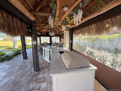 Welcome to this enchanting waterfront & golf-front tiki Lot! on Motorcoach Resort Golf Course in Florida - for sale on GolfHomes.com, golf home, golf lot