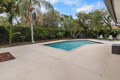 Located on a private corner lot in the highly sought-after on Carrollwood Country Club in Florida - for sale on GolfHomes.com, golf home, golf lot