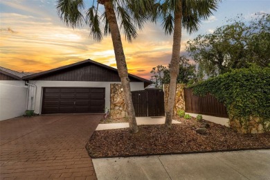 Located on a private corner lot in the highly sought-after on Carrollwood Country Club in Florida - for sale on GolfHomes.com, golf home, golf lot