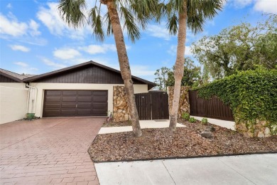 Located on a private corner lot in the highly sought-after on Carrollwood Country Club in Florida - for sale on GolfHomes.com, golf home, golf lot