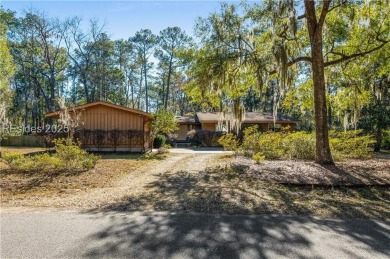 Discover this mid-century modern home in desirable Royal Pines on Ladys Island Country Club in South Carolina - for sale on GolfHomes.com, golf home, golf lot