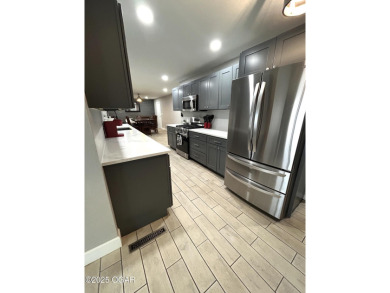 Completely remodeled golf course home offering 2,147 sq. ft. of on Baxter Country Club in Kansas - for sale on GolfHomes.com, golf home, golf lot