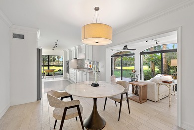 Experience effortless luxury and serene golf course views on the on Jonathans Landing Golf Club in Florida - for sale on GolfHomes.com, golf home, golf lot