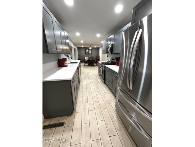 Completely remodeled golf course home offering 2,147 sq. ft. of on Baxter Country Club in Kansas - for sale on GolfHomes.com, golf home, golf lot