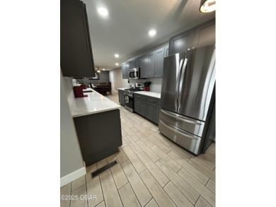 Completely remodeled golf course home offering 2,147 sq. ft. of on Baxter Country Club in Kansas - for sale on GolfHomes.com, golf home, golf lot