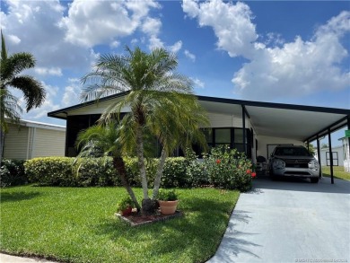 Delightful furnished home featuring wood laminate flooring on Indianwood Golf and Country Club in Florida - for sale on GolfHomes.com, golf home, golf lot