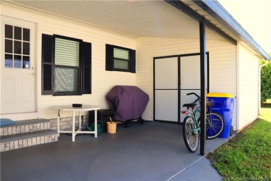 Delightful furnished home featuring wood laminate flooring on Indianwood Golf and Country Club in Florida - for sale on GolfHomes.com, golf home, golf lot