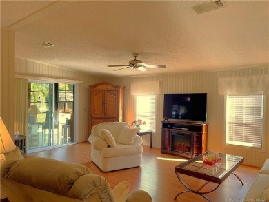 Delightful furnished home featuring wood laminate flooring on Indianwood Golf and Country Club in Florida - for sale on GolfHomes.com, golf home, golf lot
