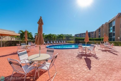 This 4th-floor 55+ penthouse condo offers spectacular views of on Sunrise Lakes Phase III in Florida - for sale on GolfHomes.com, golf home, golf lot