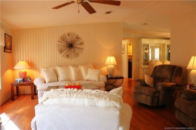 Delightful furnished home featuring wood laminate flooring on Indianwood Golf and Country Club in Florida - for sale on GolfHomes.com, golf home, golf lot