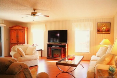 Delightful furnished home featuring wood laminate flooring on Indianwood Golf and Country Club in Florida - for sale on GolfHomes.com, golf home, golf lot