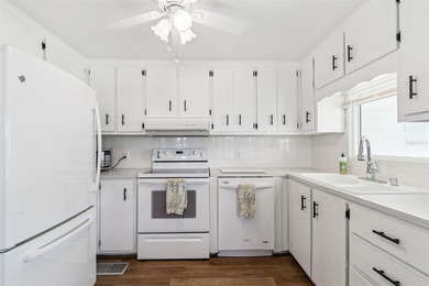 Cozy Beach-Cottage Vibes in Fairway Village -- Where the Living on Fairway Village Golf Course in Florida - for sale on GolfHomes.com, golf home, golf lot