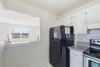 Beautiful corner unit with serene canal views in the highly on Kings Point Golf -Flanders Way in Florida - for sale on GolfHomes.com, golf home, golf lot