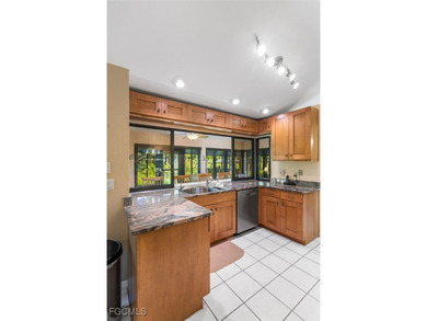 Welcome to your dream home with stunning GOLF & NATURE VIEWS in on Cross Creek Country Club in Florida - for sale on GolfHomes.com, golf home, golf lot