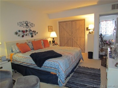 Top-floor waterfront condo featuring 3 bedrooms, 2 bathrooms on Seasons Ridge At Four Seasons in Missouri - for sale on GolfHomes.com, golf home, golf lot